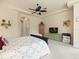 This cozy bedroom has a ceiling fan, neutral walls, and large doorways at 8373 Maybelle Dr, Weeki Wachee, FL 34613