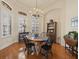 Dining room with hardwood floors, wainscoting, and natural light from the windows at 8373 Maybelle Dr, Weeki Wachee, FL 34613