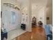 Bright entryway with arched doorways, hardwood flooring, and views of the dining and living areas at 8373 Maybelle Dr, Weeki Wachee, FL 34613