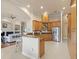 Spacious kitchen featuring wooden cabinets, granite countertops and stainless steel appliances at 8373 Maybelle Dr, Weeki Wachee, FL 34613