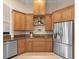 The kitchen is arranged with stainless steel appliances and granite countertops at 8373 Maybelle Dr, Weeki Wachee, FL 34613