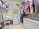 Walk-in closet with white shelving, drawers, and hanging storage at 8373 Maybelle Dr, Weeki Wachee, FL 34613