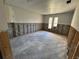 Spacious bedroom showcasing a blank canvas for renovation with natural light from two windows at 8607 Longboat Ln, Hudson, FL 34667