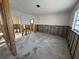 Open-concept living area featuring exposed framing, offering a unique opportunity for a custom renovation project at 8607 Longboat Ln, Hudson, FL 34667