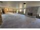 Expansive living room with a brick fireplace offering ample space for customization and creative design at 8607 Longboat Ln, Hudson, FL 34667