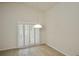 Cozy dining area with wood floors, chandelier, and plantation shutters at 9634 Green Needle Dr, New Port Richey, FL 34655