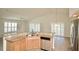 Stylish kitchen features wooden cabinetry, granite countertops, stainless steel appliances, and open design at 9634 Green Needle Dr, New Port Richey, FL 34655