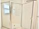 Modern bathroom featuring a glass enclosed standing shower with tiled walls at 9634 Green Needle Dr, New Port Richey, FL 34655