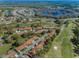 High-angle view of a community bordering a golf course and lake, displaying the scenic neighborhood layout at 9713 Sweeping View Dr, New Port Richey, FL 34655