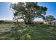 Expansive lawn, mature trees create peaceful backyard of neighboring homes with great light and shade at 9713 Sweeping View Dr, New Port Richey, FL 34655