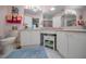 Bright bathroom with white cabinets, granite countertops, and decorative accents at 9713 Sweeping View Dr, New Port Richey, FL 34655