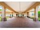 Inviting entryway with brick-paved floor, supported by large columns, leading to a bright, welcoming building entrance at 9713 Sweeping View Dr, New Port Richey, FL 34655