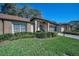 Inviting single-story home showcases beautiful landscaping and a well-kept lawn, adding to its curb appeal at 9713 Sweeping View Dr, New Port Richey, FL 34655