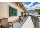 Outdoor patio with seating alongside building, near pool area, offering a relaxing space with views at 9713 Sweeping View Dr, New Port Richey, FL 34655