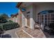Inviting front porch featuring decorative chairs and stylish accents, complemented by the home's brick facade at 9713 Sweeping View Dr, New Port Richey, FL 34655