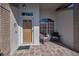Inviting front porch with decorative chairs and a welcoming entrance featuring a stylishly adorned door at 9713 Sweeping View Dr, New Port Richey, FL 34655