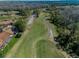 Expansive green golf course view with meticulously manicured lawns and mature trees, ready for tee-off at 9713 Sweeping View Dr, New Port Richey, FL 34655