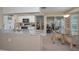 Open kitchen featuring granite countertops and access to the breakfast nook and lanai at 9713 Sweeping View Dr, New Port Richey, FL 34655