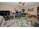 Spacious office with neutral walls and tropical patterned carpet at 9713 Sweeping View Dr, New Port Richey, FL 34655