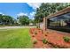 Timber Greens entrance sign highlighted by freshly laid mulch and trimmed green lawn at 9713 Sweeping View Dr, New Port Richey, FL 34655