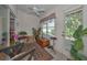 Inviting sunroom with tile floors, large windows, and comfortable seating at 9713 Sweeping View Dr, New Port Richey, FL 34655