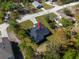Aerial view of the home's roof, concrete driveway and surrounding neighborhood at 10379 Golden Ave, Brooksville, FL 34613