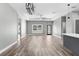 Open concept living room area with great natural lighting and sleek wood floors at 10379 Golden Ave, Brooksville, FL 34613