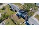 Aerial view of the property showing the backyard, neighboring homes, and surrounding landscape at 10841 Scenic Dr, Port Richey, FL 34668