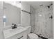 Updated bathroom featuring marbled tile in the shower at 10841 Scenic Dr, Port Richey, FL 34668