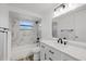 Updated bathroom features a marble tiled shower, modern vanity, and sleek fixtures at 10841 Scenic Dr, Port Richey, FL 34668
