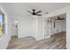 Bedroom boasts wood-look floors and access to a private bathroom at 10841 Scenic Dr, Port Richey, FL 34668