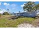Single story home with a well-maintained lawn with great backyard space at 10841 Scenic Dr, Port Richey, FL 34668