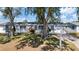 Charming single-story home with well-maintained lawn and mature trees providing ample shade at 10841 Scenic Dr, Port Richey, FL 34668