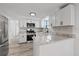 Modern kitchen featuring stainless steel appliances and granite countertops at 10841 Scenic Dr, Port Richey, FL 34668