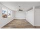 Sunny living room with light-colored wood floors and natural light at 10841 Scenic Dr, Port Richey, FL 34668