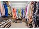 Walk-in closet featuring organized shelving for clothing and shoe storage at 1107 Sweet Jasmine Dr, Trinity, FL 34655