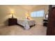 Cozy bedroom with a queen bed and traditional bedside tables with lamps at 11817 Bayonet Ln, New Port Richey, FL 34654