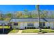Charming townhouse with a covered parking spot and a well-maintained lawn at 11817 Bayonet Ln, New Port Richey, FL 34654