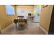 Eat-in kitchen showcases a table with seating and light-filled windows at 11817 Bayonet Ln, New Port Richey, FL 34654