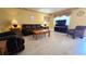 Comfortable living room with neutral tile flooring and well-coordinated furniture at 11817 Bayonet Ln, New Port Richey, FL 34654