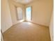 Spacious bedroom featuring neutral carpet and natural light at 12151 Putter Green Ct, New Port Richey, FL 34654