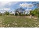 Expansive backyard with mature trees, offering a private and serene outdoor space at 13140 Maycrest Ave, Weeki Wachee, FL 34614