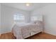 Bright bedroom featuring a white bed frame and ample natural light at 13140 Maycrest Ave, Weeki Wachee, FL 34614