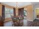 Inviting dining area with a wooden table, chairs, and view to the patio at 13140 Maycrest Ave, Weeki Wachee, FL 34614