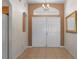 Warm and inviting foyer with double doors and tile flooring at 13140 Maycrest Ave, Weeki Wachee, FL 34614