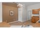 Cozy kitchen with a chandelier, wood cabinets, and tile flooring at 13140 Maycrest Ave, Weeki Wachee, FL 34614