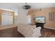 Comfortable living room with laminate flooring and entry to foyer at 13140 Maycrest Ave, Weeki Wachee, FL 34614