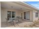 Comfortable patio featuring outdoor dining set and sliding glass doors to the interior at 13140 Maycrest Ave, Weeki Wachee, FL 34614