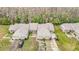 High aerial view showcasing a well-maintained home with lush landscaping, complemented by a two-car garage at 13227 Molitor Ct, Hudson, FL 34669