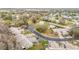 Aerial view of the community with beautiful tree lined streets and ponds at 13227 Molitor Ct, Hudson, FL 34669